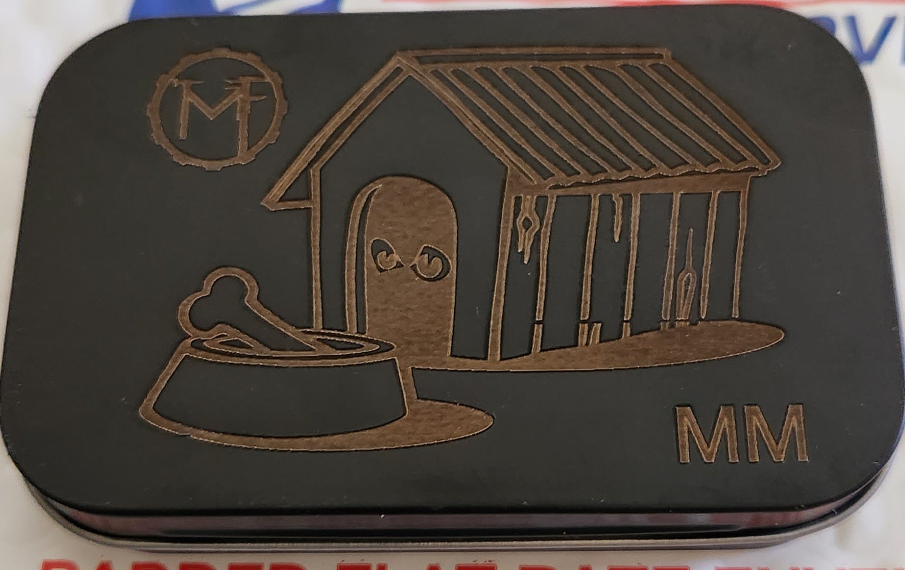 Custom engraved tin to contain tools.